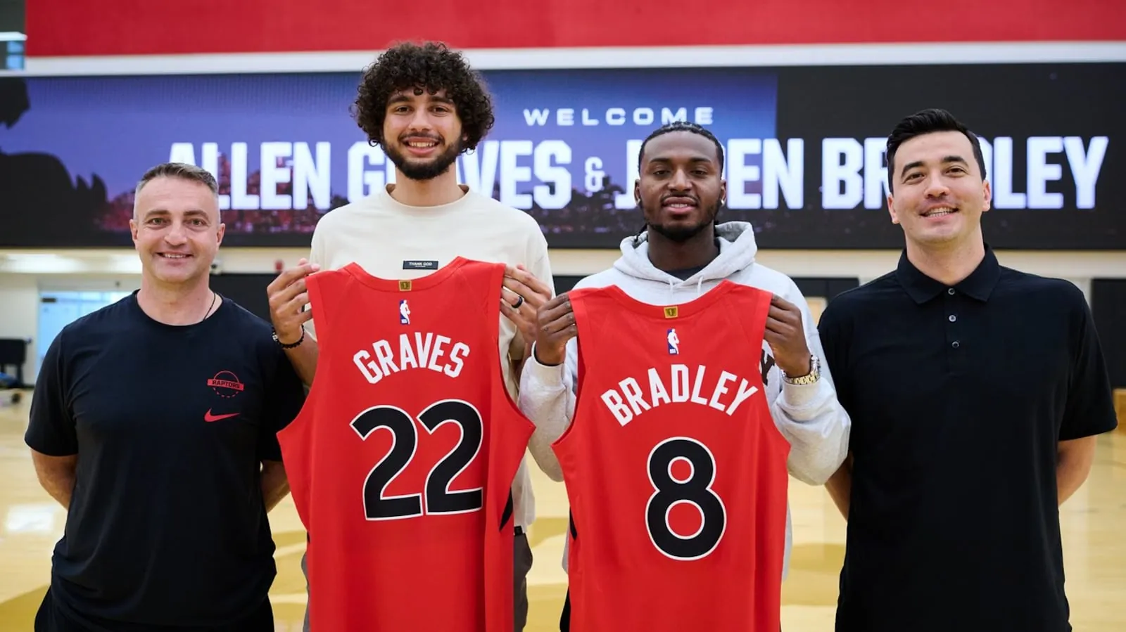 Toronto Raptors head coach Darko Rajakovic, left to right, 2026 draft picks Allen Graves and Jaden Bradley, and general manager Bobby Webster pose for a photo in Toronto, on Thursday, June 25, 2026. THE CANADIAN PRESS/Sammy Kogan