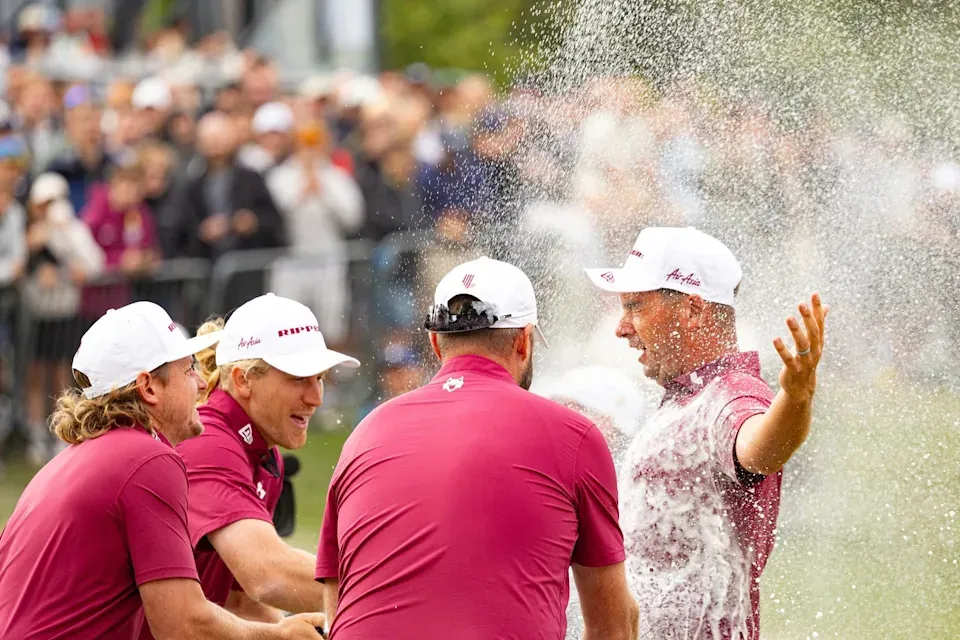 Individual champion Lucas Herbert, right, of Ripper GC, celebrates after his win with teammates Cameron Smith, Marc Leishman and Travis Smyth on the 18th green following the final round of the LIV Golf United Kingdom golf tournament Sunday, July 26, 2026, in Rocester, England. (Jon Ferrey/LIV Golf via AP) - The Associated Press