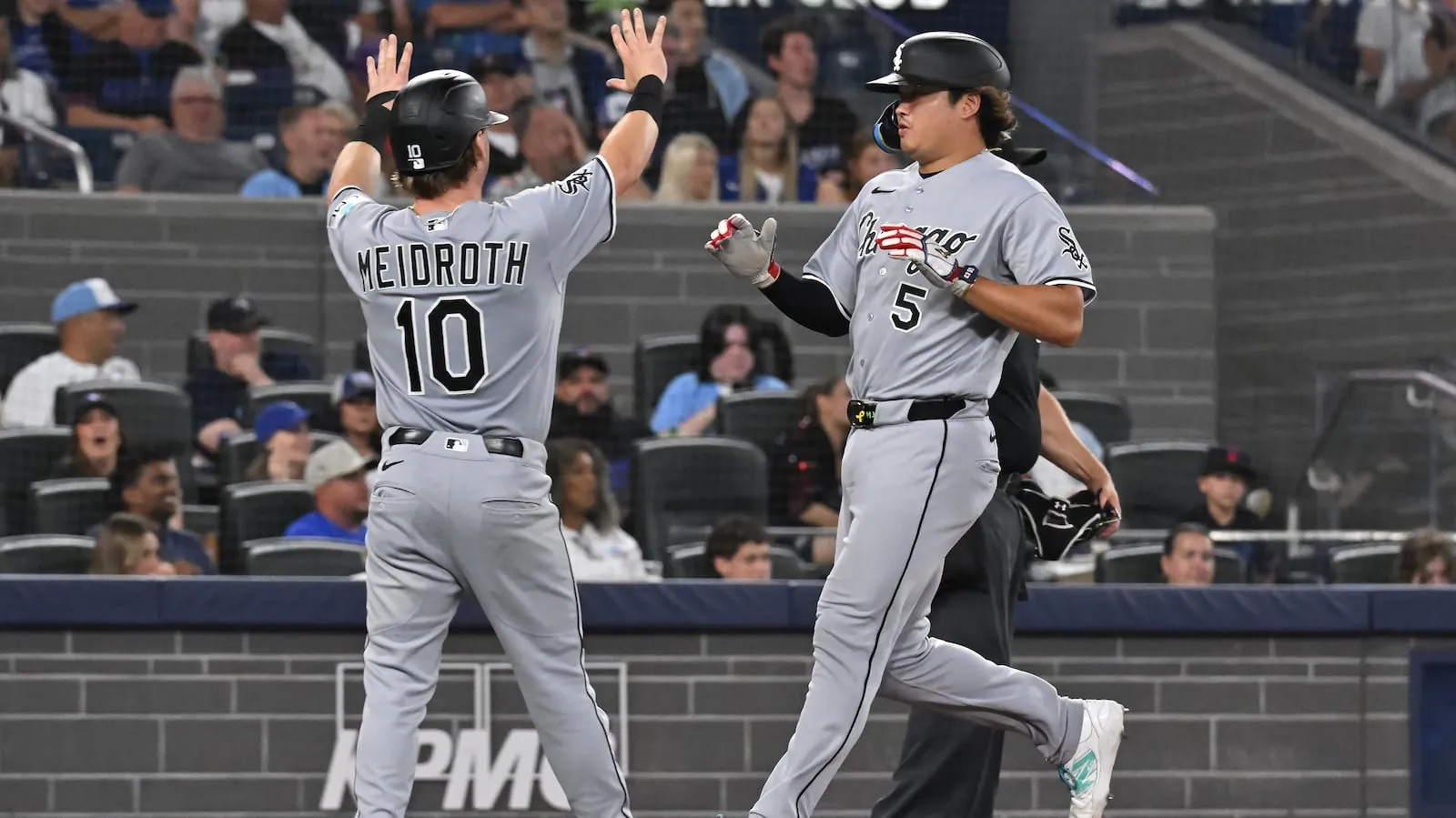 Chicago White Sox' Chase Meidroth (10) and Munetaka Murakami celebrate scoring on a three-RBI double by teammate Colson Montgomery during fifth inning MLB baseball action in Toronto on Friday, July 17, 2026. THE CANADIAN PRESS/Jon Blacker(Jon Blacker/The Canadian Press)