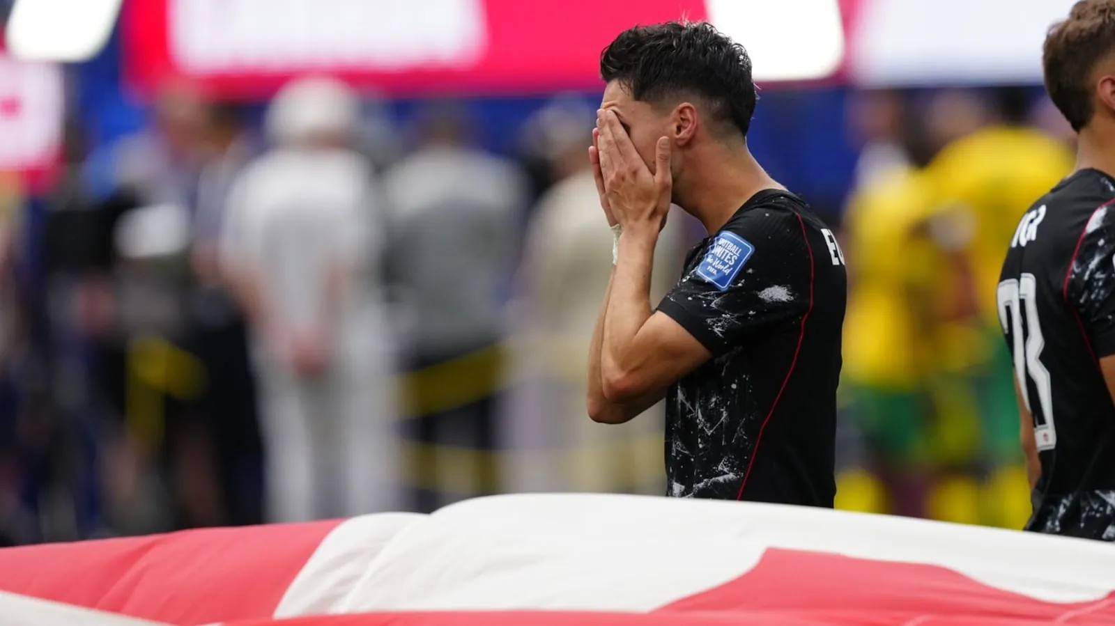 Canada's Stephen Eustáquio (7) reacts as the Canada flag is carried around after defeating South Africa during second half World Cup Round of 32 soccer, in Los Angeles, on Sunday, June 28, 2026. THE CANADIAN PRESS/Frank Gunn
